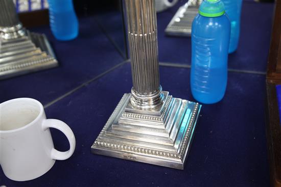 A late Victorian silver corinthian column oil lamp by Walker & Hall, overall height 87cm.